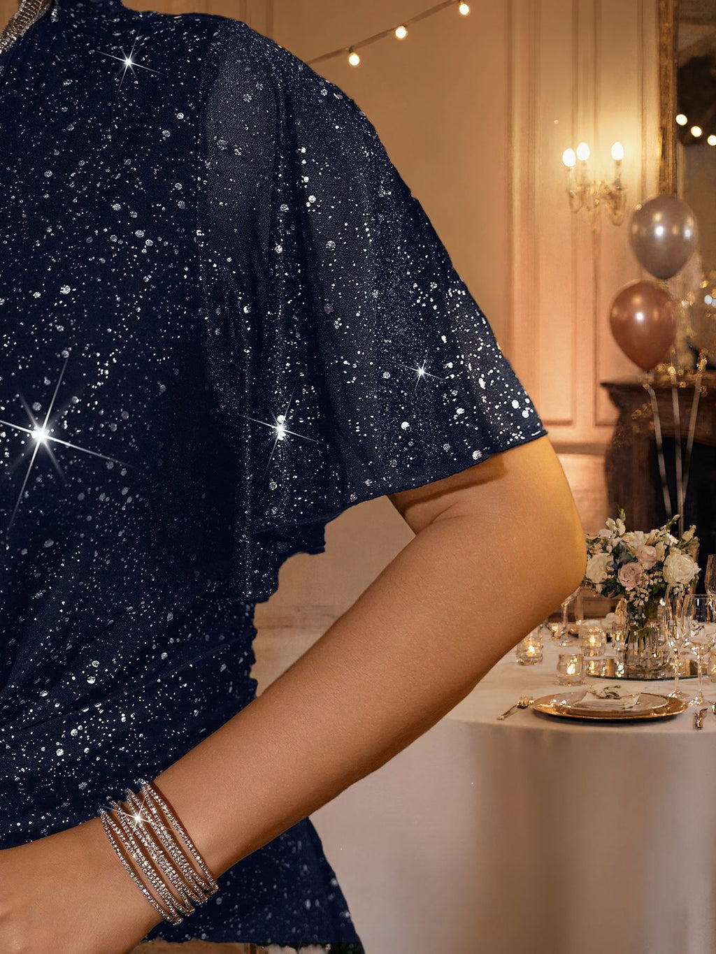 Plus-Size Glitter Wrap-Front Party Dress with Flutter Sleeves in Navy — close-up of the sheer flutter sleeve