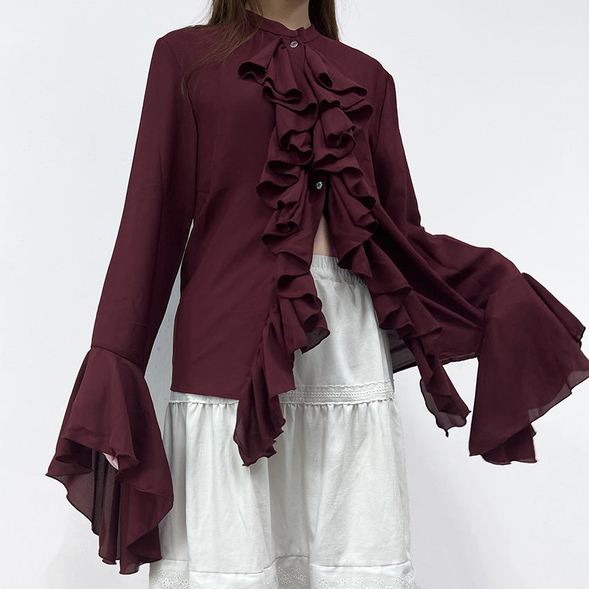 Cascading Ruffle Blouse with Bell Sleeves in Burgundy — on model over a white skirt