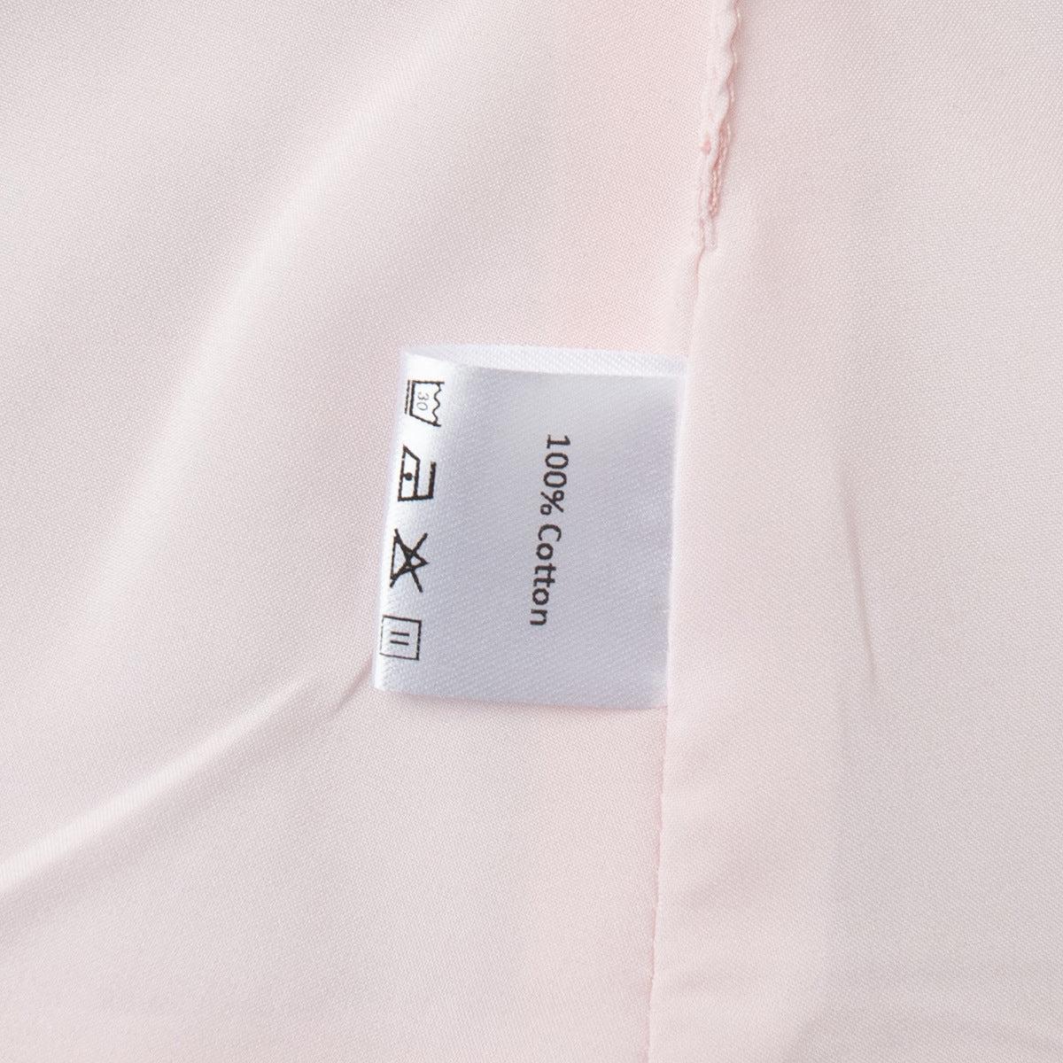 Cotton Peplum Vest & Bubble Mini Skirt Set in Soft Pink — close-up of the 100% cotton label