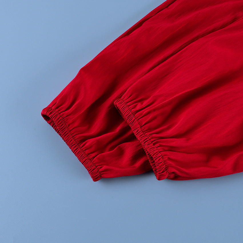 Button-Placket Stand-Collar Jacket with Elastic Cuffs in Red — close-up of the elasticated cuff