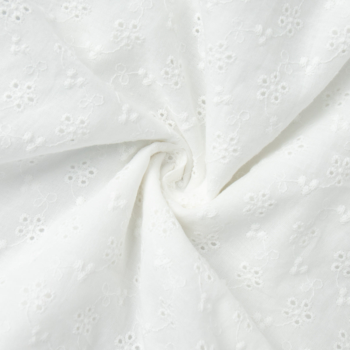 Eyelet Cotton Off-Shoulder Midi Dress in Ivory Eyelet — close-up of eyelet embroidery
