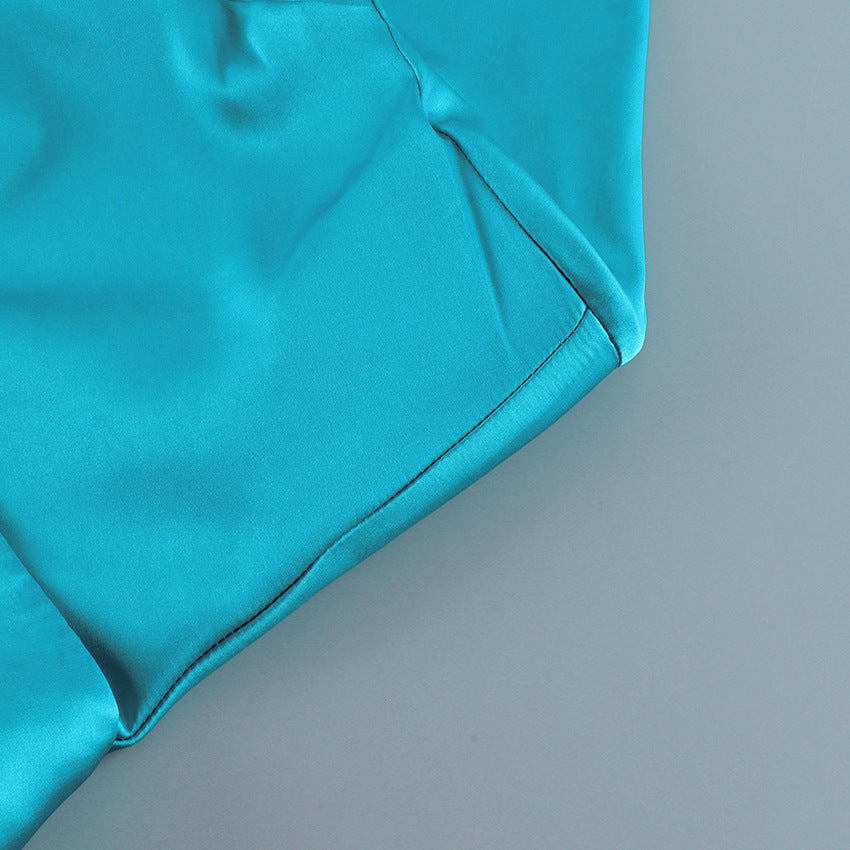 Fitted Stretch Satin Button-Up Shirt in Teal — close-up of the curved hem