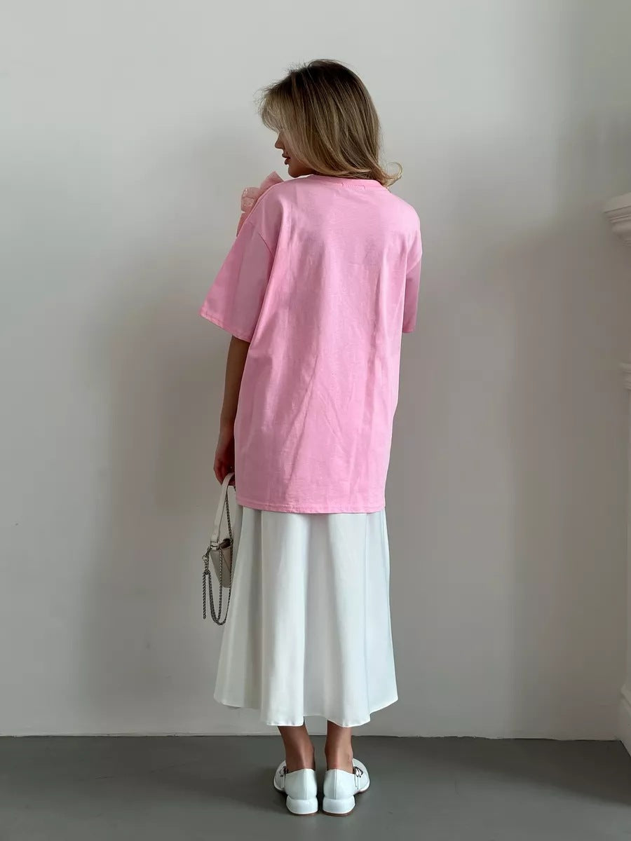 Oversized Cotton Tee with a Rhinestone Bow in Pink — back view on model