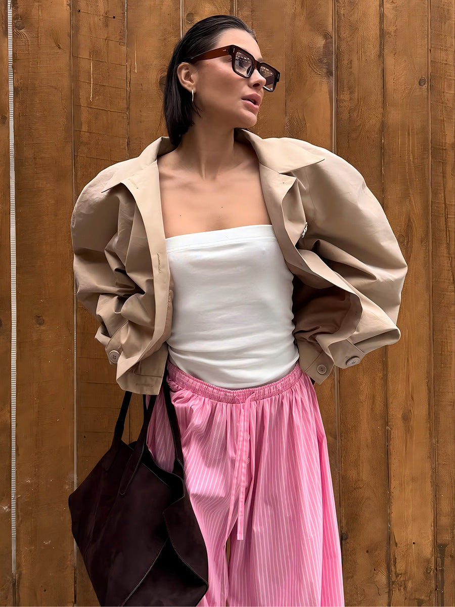 Striped Balloon Harem Pants in Pink Stripe — outdoor view with tan jacket