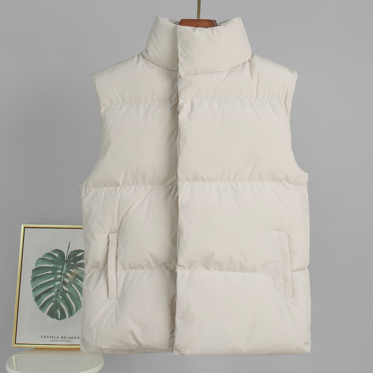 Longline Puffer Vest with High Stand Collar in Cream — front view