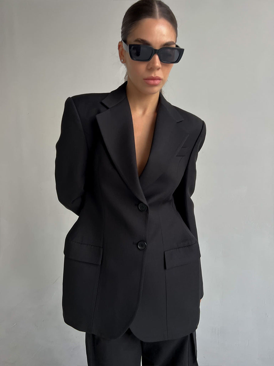 Tailored Two-Button Blazer with Cinched Waist in Black — close-up on model