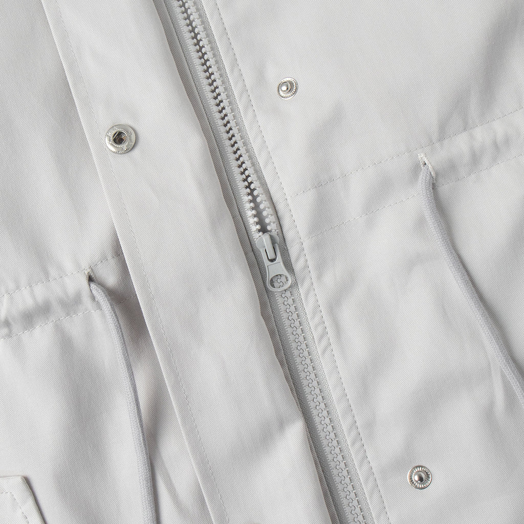 Cotton Drawstring Waist Jacket with Stand Collar in Off-White — close-up of front zipper