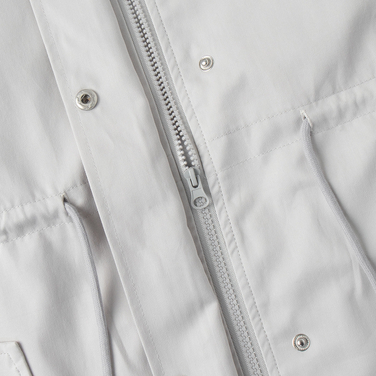 Cotton Drawstring Waist Jacket with Stand Collar in Off-White — close-up of front zipper