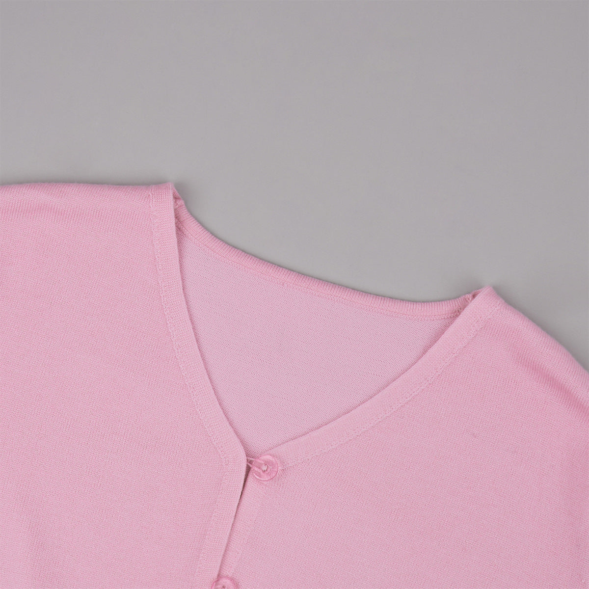 Cropped Button Cardigan & Fold-Over Waist Wide-Leg Knit Pants Set in Blush Pink — close-up of the V-neck