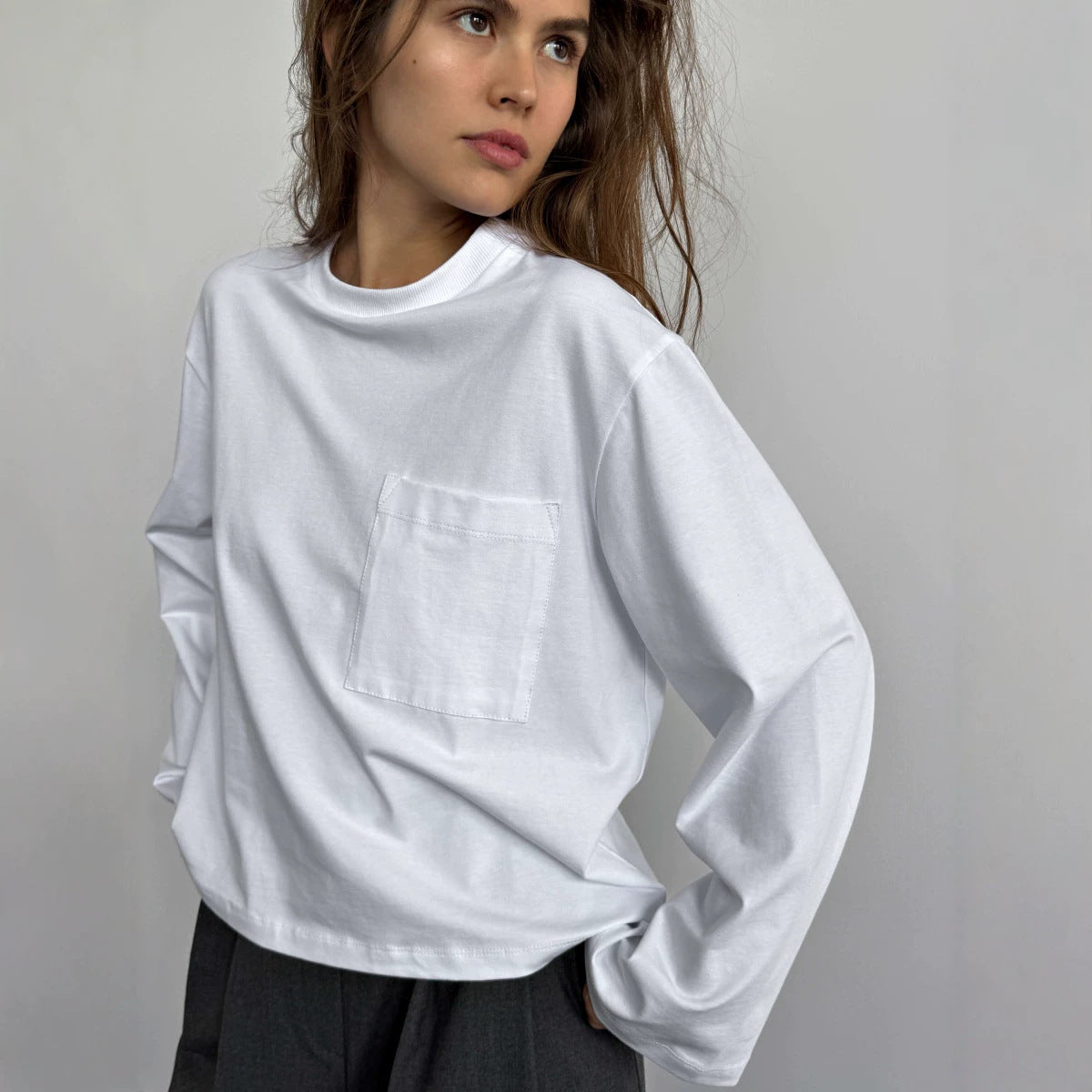 Relaxed Cotton Long-Sleeve Pocket Tee in White — close-up of the chest pocket