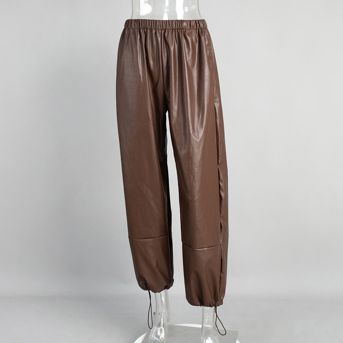 Faux Leather Balloon Pants with Drawstring Ankles in Cognac — front view on mannequin