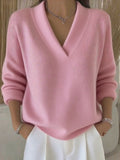Relaxed V-Neck Knit Sweater in Pink — front view on model