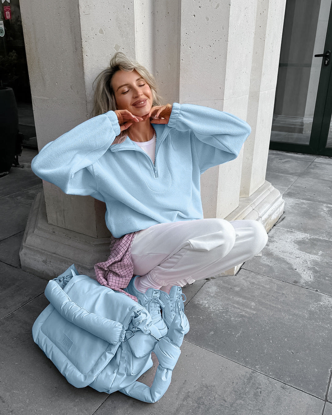 Relaxed Half-Zip Fleece Pullover with Elastic Hem in Sky Blue — seated view on model