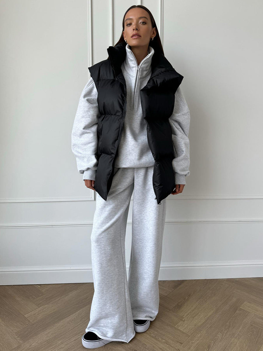 Longline Puffer Vest with High Stand Collar in Black — full-length view