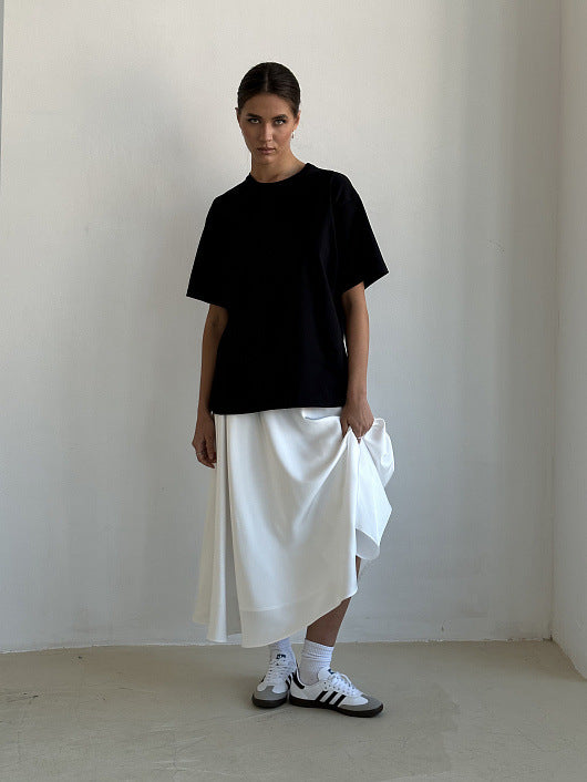 Satin A-Line Midi Skirt with Elastic Waist in Ivory White — on model with a black tee