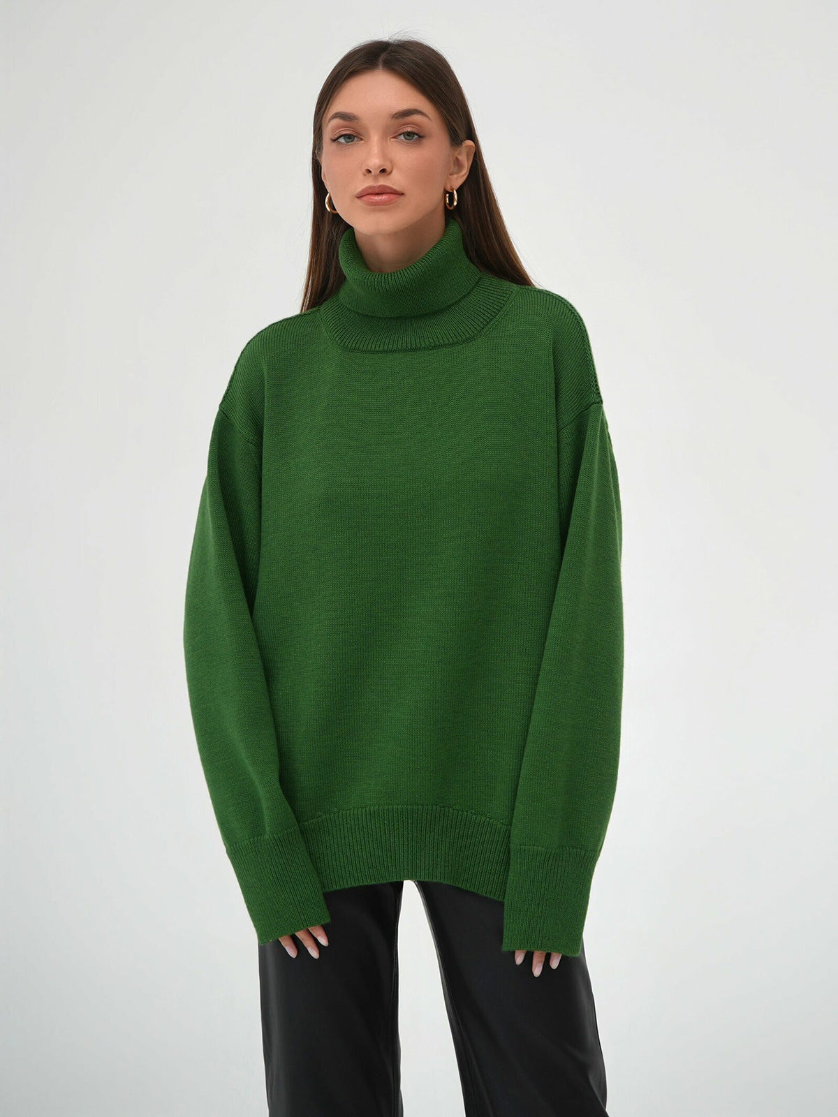 Oversized Knit Turtleneck Sweater in Forest Green — front view with black leather pants
