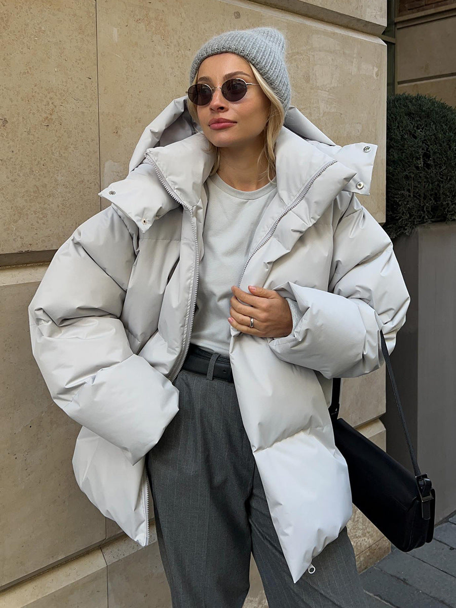Matte Oversized Hooded Puffer Jacket in Light Gray — worn open over a hoodie