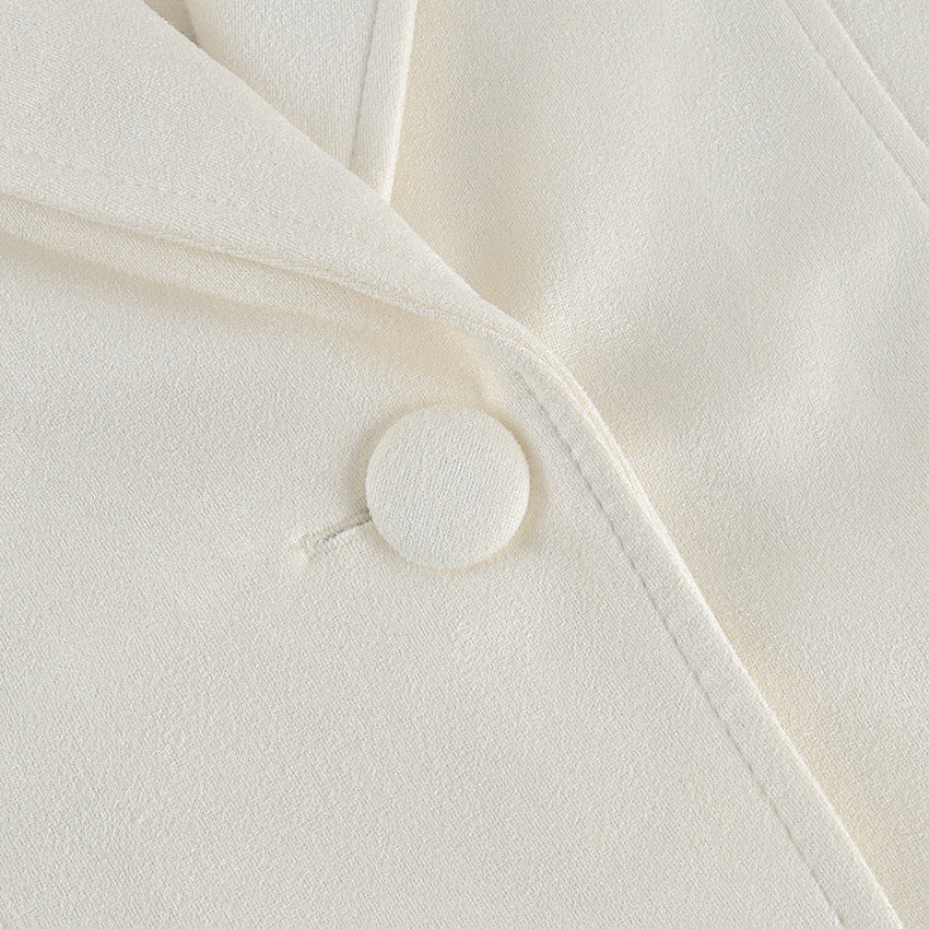 Belted Faux Suede Jacket with Shawl Collar in Ivory — close-up of the covered button