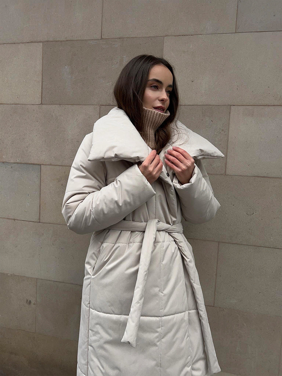 Long Belted Puffer Coat with Oversized Collar in Cream — close-up of the collar and belt on model