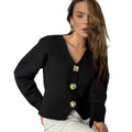 Sculptural Gold-Tone Button Knit Cardigan in Black — front view on model