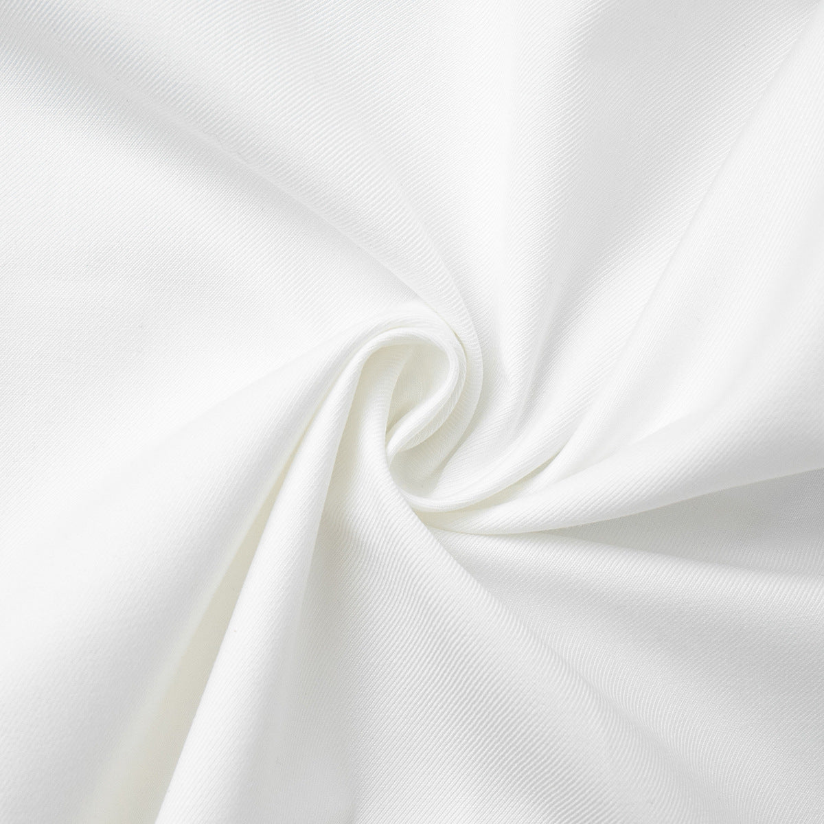 High-Waist Pleated Bermuda Shorts in White — close-up of fabric