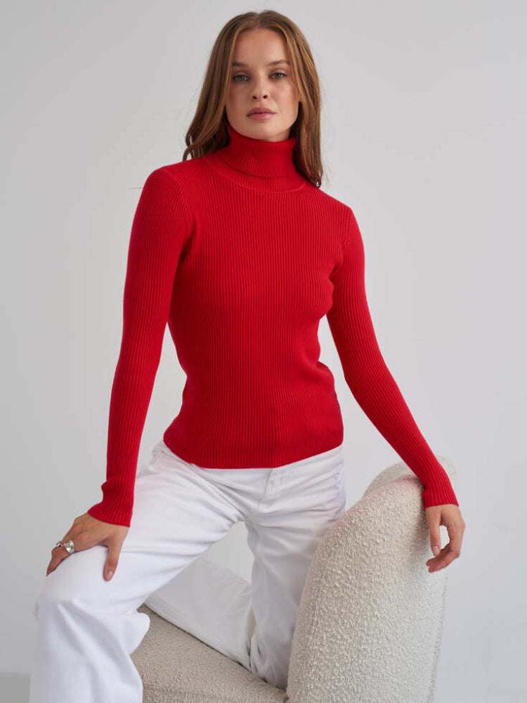 Fitted Ribbed Turtleneck Sweater in Red — full-length view on model