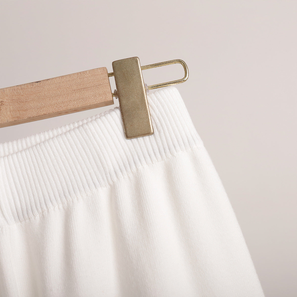 Polo Collar Knit Sweater & Wide-Leg Pants Set in Ivory — close-up of ribbed elastic waistband