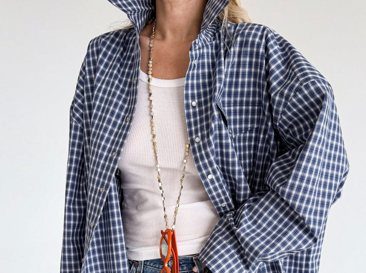 Oversized Cotton Plaid Button-Up Shirt in Navy Plaid — front view on model over a white tank