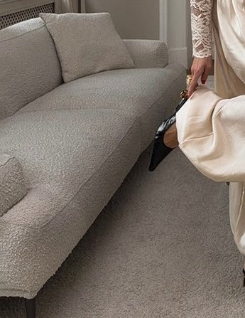 Shiny Pleated Harem Pants with Elastic Cuffs in Apricot — on model, cropped to show pants