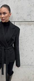 Oversized Double-Breasted Belted Blazer Jacket in Black — front view on model with the belt tied