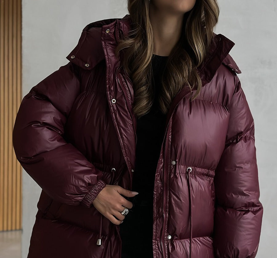 Hooded Puffer Jacket with Drawstring Waist in Burgundy — front view on model