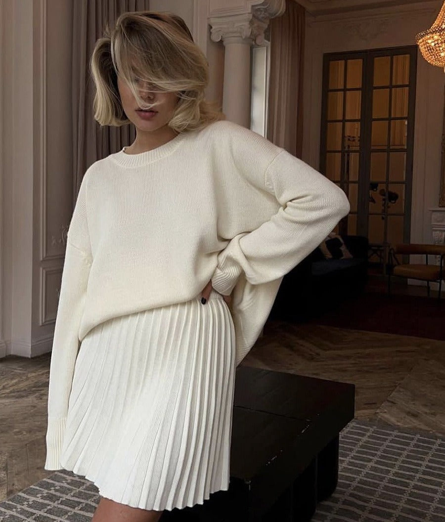 Oversized Crew Neck Sweater & Pleated Knit Mini Skirt Set in Ivory — side view on model