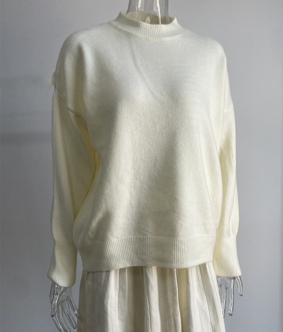 Oversized Crew Neck Sweater & Pleated Knit Mini Skirt Set in Ivory — set on a form