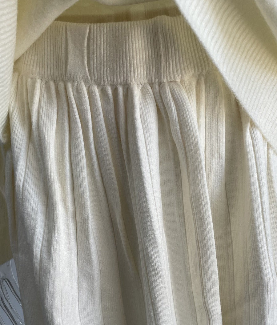 Oversized Crew Neck Sweater & Pleated Knit Mini Skirt Set in Ivory — close-up of the skirt waistband and pleats